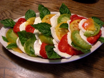 heirloom tomatoes and mozzarella, with lettuce leaf basil